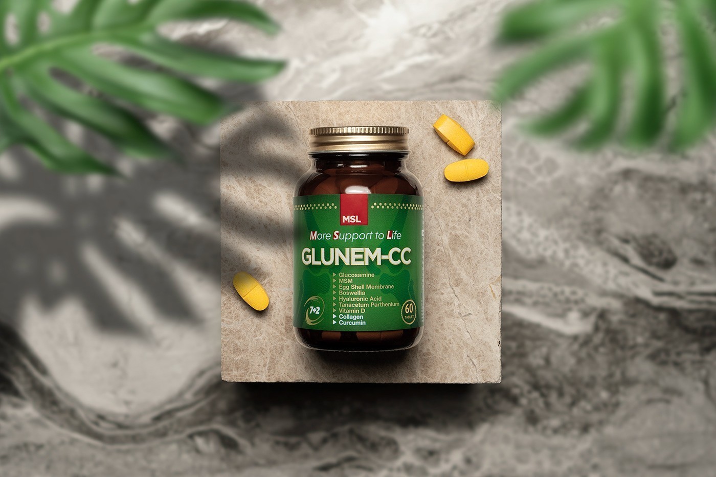 Glunem-CC bottle in a natural stone and foliage composition